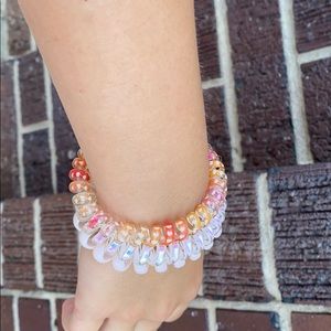 A three set ponytail/bracelet